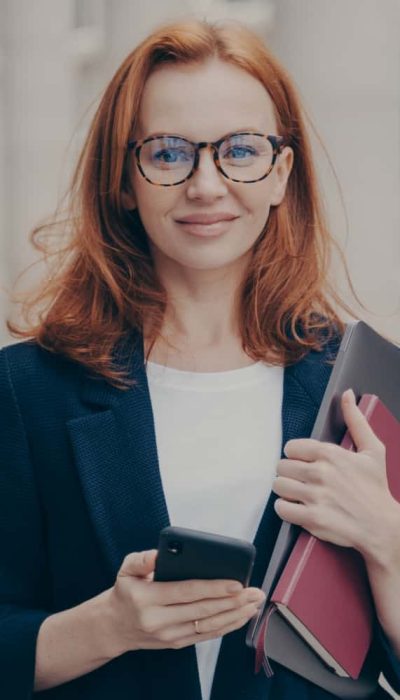 confident-beautiful-red-haired-female-business-con-2021-12-09-05-58-20-utc-min.jpg